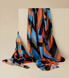 Art Deco zigzag scarf A lightweight scarf featuring an Art Deco zig zag pattern in bright orange, blue and black.