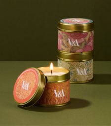 Cosy homeware Scented V&A tin candles featuring exclusive floral patterns from the Museum's archive.